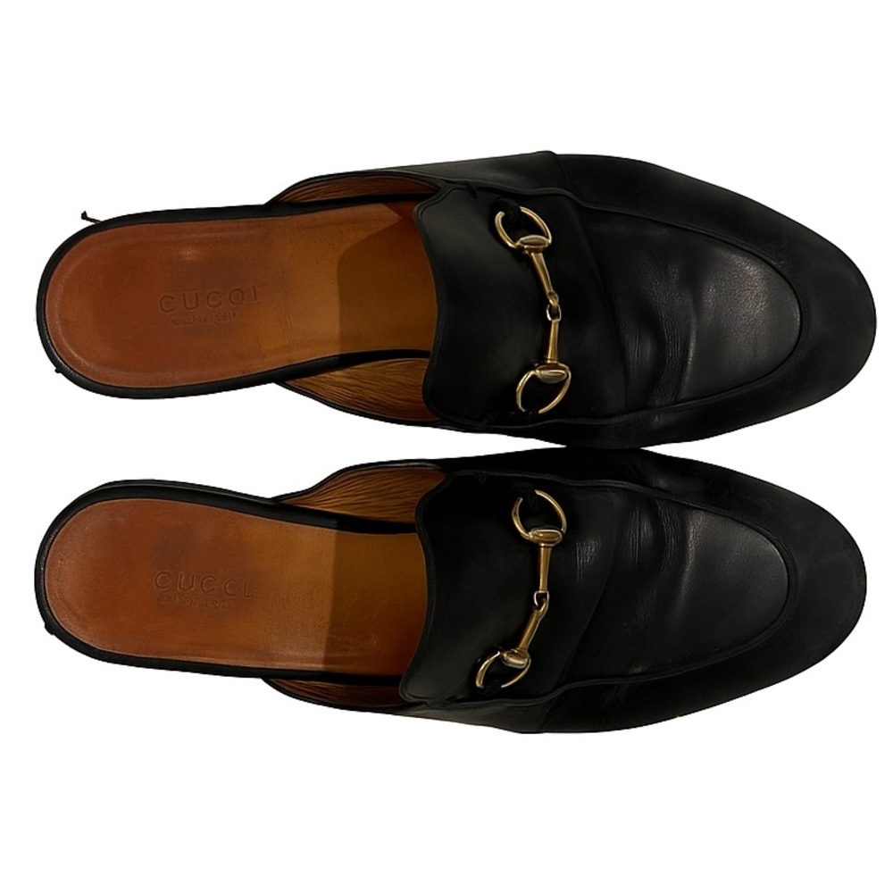 Gucci black loafers with gold detail